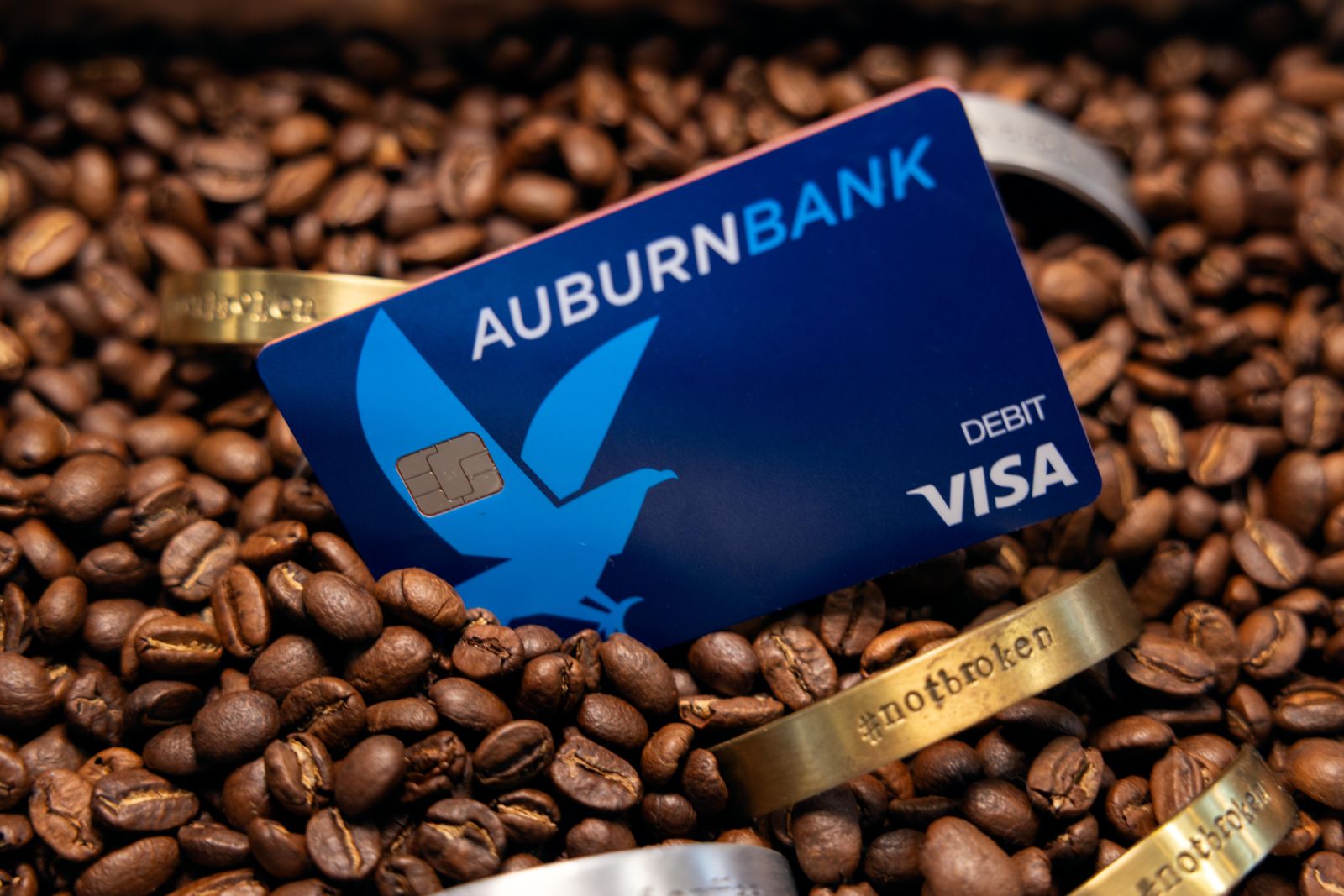 AuburnBank debit card in coffee beans